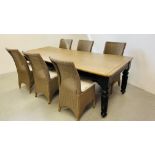 A LARGE RECTANGULAR DINING TABLE THE WAXED HARDWOOD TOP OVER PAINTED BASE WITH REEDED LEG AND THREE
