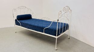 AN ANTIQUE FRENCH WHITE PAINTED METAL FRAMED DAY BED