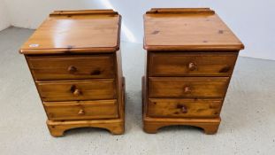 A PAIR OF DUCAL HONEY PINE THREE DRAWER BEDSIDE CHESTS EACH W 47CM, D 45CM, H 61CM.