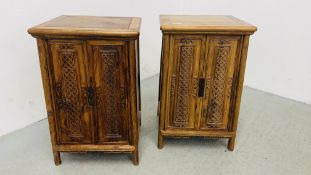 A PAIR OF SMALL REPRODUCTION ORIENTAL DESIGN TWO DOOR HARDWOOD CABINETS WITH SINGLE INTERNAL DOOR -