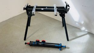 AN EVOLUTION FOLDING MITRE SAW WORK STAND AND EBAUER TRIPOD CLAMPING STAND