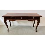 A REPRODUCTION HARDWOOD THREE DRAWER CONSOLE TABLE W 135CM, D 47CM, H 76CM.