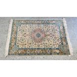PERSIAN RUG, THE CENTRAL LOBED MOTIF ON AN IVORY GROUND - L 150CM X W 99CM.