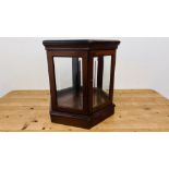 A HEXAGONAL MAHOGANY GLASS PANELLED DISPLAY CABINET, W 61CM X H 58CM.