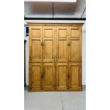 AN IMPRESSIVE OVERSIZE EIGHT DOOR WAXED PINE LARDER CUPBOARD WITH SHELVED INTERIOR (TWO SECTIONS) -