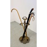 A VINTAGE BRASS ACANTHUS UMBRELLA STAND ALONG WITH 4 WALKING STICKS TO INCLUDE SILVER BANDED ALONG