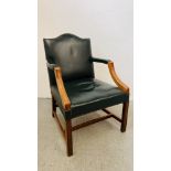 A BOTTLE GREEN LEATHER UPHOLSTERED OPEN ARM CHAIR