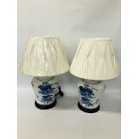 PAIR OF LARGE BLUE AND WHITE TABLE LAMPS WITH CREAM PLEATED SHADES - SOLD AS SEEN.