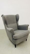A MODERN IKEA DESIGNER WINGED ARM CHAIR GREY UPHOLSTERED.