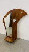 A RETRO MID CENTURY HALL MIRROR / SHELF WITH INSET BAROMETER.