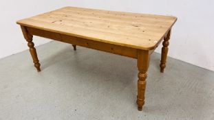 A SOLID WAXED PINE FARMHOUSE KITCHEN TABLE WITH DRAWER TO END L 180CM. W 98CM.