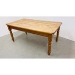 A SOLID WAXED PINE FARMHOUSE KITCHEN TABLE WITH DRAWER TO END L 180CM. W 98CM.