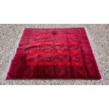 A BELOUCH RUG, THREE ROWS OF GULLS ON A RED FIELD - L 275CM X W 206CM.