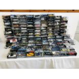 APPROX 134 DIE-CAST MODEL VEHICLES RELATING TO "JAMES BOND 007" IN ORIGINAL DISPLAY CASES ALONG