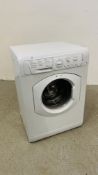 A HOTPOINT 7KG ESSENTIALS WASHING MACHINE - SOLD AS SEEN.