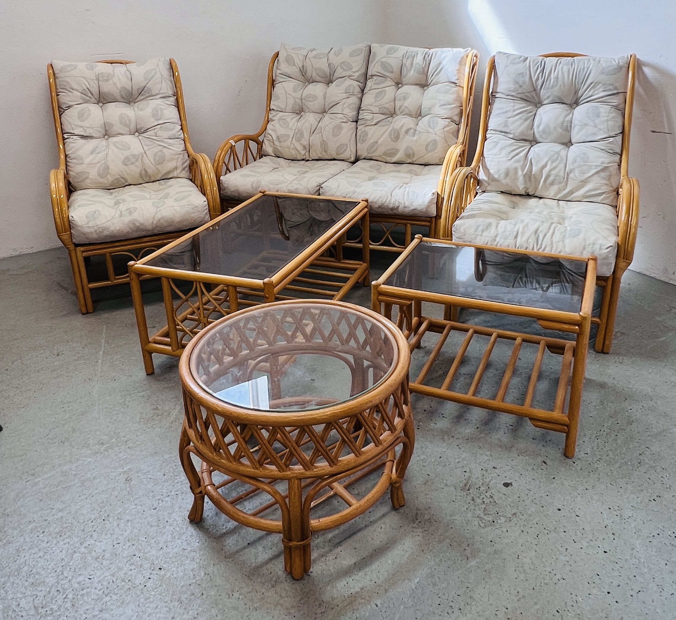 A SUITE OF CANE CONSERVATORY FURNITURE TO INCLUDE TWO CHAIRS, TWO SEATER SOFA,