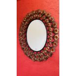 A MODERN DESIGNER METAL CRAFT OVAL WALL MIRROR OF PEACOCK FEATHER DESIGN