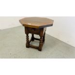 A SOLID OAK OCCASIONAL TABLE WITH SINGLE DRAWER AND OCTAGONAL TOP