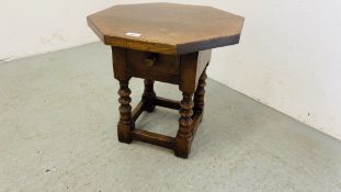 A SOLID OAK OCCASIONAL TABLE WITH SINGLE DRAWER AND OCTAGONAL TOP