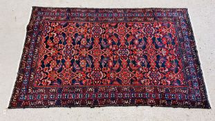 PERSIAN RUG WOVEN WITH STYLIZED BIRDS ON A DARK BLUE FIELD,