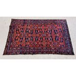 PERSIAN RUG WOVEN WITH STYLIZED BIRDS ON A DARK BLUE FIELD,