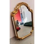 ORNATE SHAPED WALL MIRROR IN GILT DECORATED FRAMEWORK - HEIGHT 100CM. WIDTH 66CM.