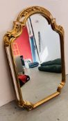 ORNATE SHAPED WALL MIRROR IN GILT DECORATED FRAMEWORK - HEIGHT 100CM. WIDTH 66CM.