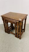 A SET OF GOOD QUALITY SOLID OAK NEST OF THREE TABLES.