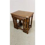 A SET OF GOOD QUALITY SOLID OAK NEST OF THREE TABLES.