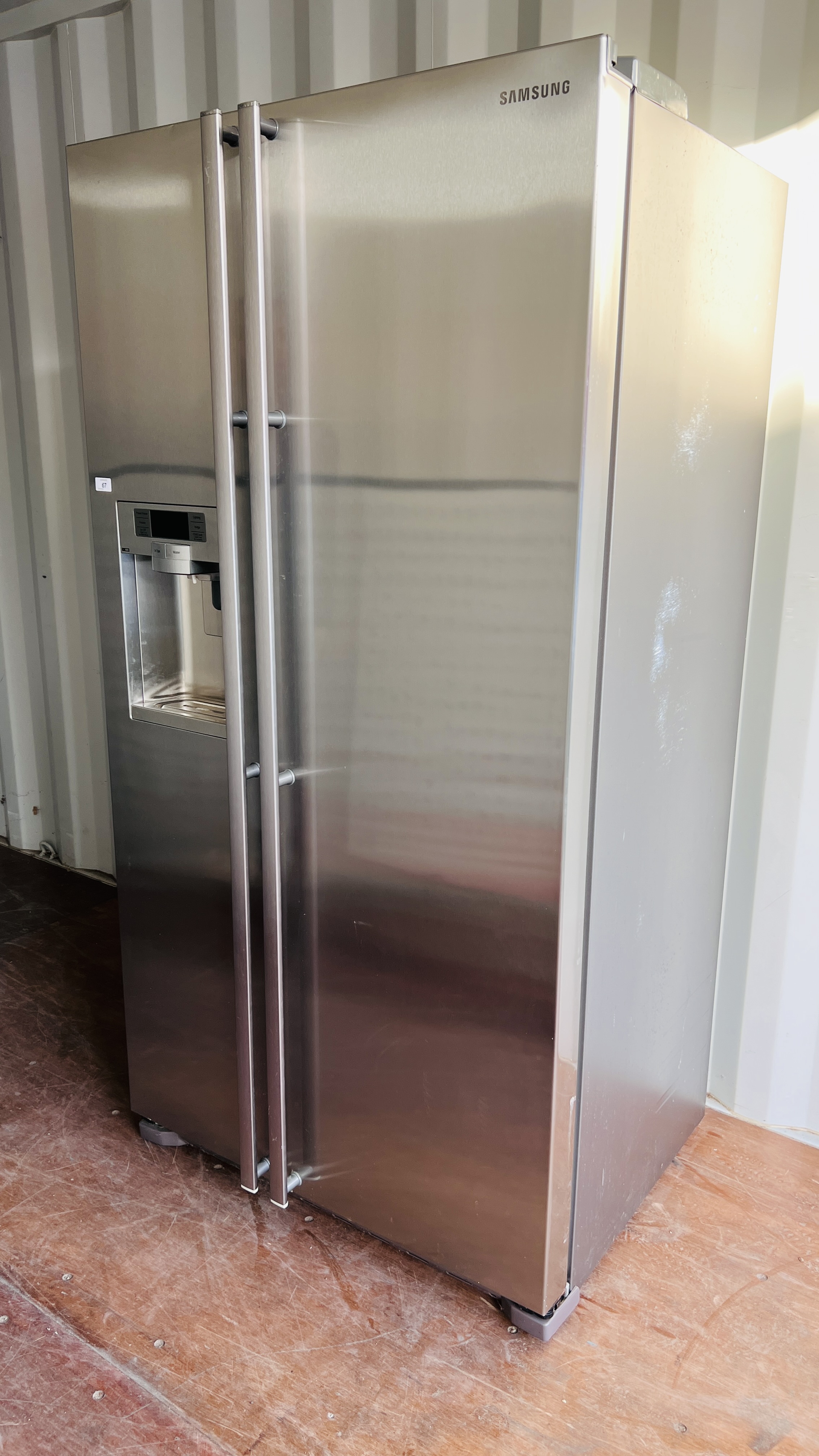 A SAMSUNG AMERICAN STYLE FRIDGE WITH ICED WATER MACHINE - SOLD AS SEEN