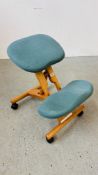 A BACK SUPPORT WHEELED KNEELING CHAIR.