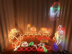 7 ASSORTED CHRISTMAS LED LIGHT DECORATIONS TO INCLUDE SANTA ON A TRAIN, SANTA STOP SIGN, TRAIN,