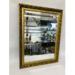 A GILT FRAMED MIRROR WITH BEVELLED PLATE GLASS 82CM X 63CM.