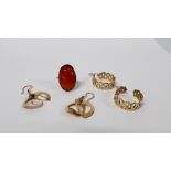 TWO PAIRS OF EARRINGS MARKED 585 AND 14K ALONG WITH A YELLOW METAL RING SET WITH CENTRAL OVAL