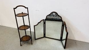 AN ANTIQUE OAK THREE TIER FOLDING CAKE STAND AND OAK FRAMED TRIPLE DRESSING MIRROR WITH ARCHED TOP.