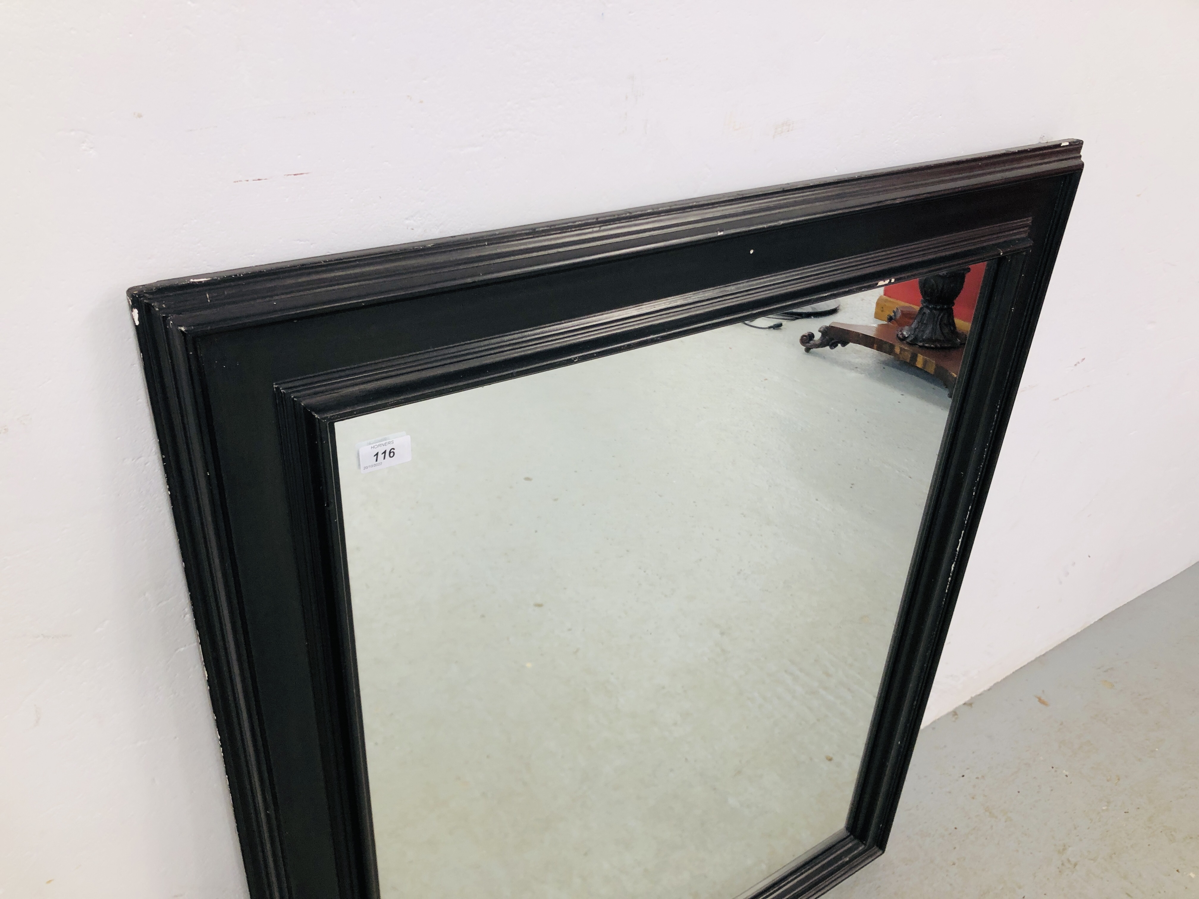 A LARGE BLACK FRAMED WALL MIRROR 112CM X 95CM. - Image 2 of 3