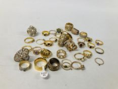 BOX OF GOLD TONE RINGS WITH A MIXTURE OF CRYSTAL STONES
