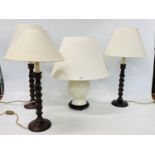 A MODERN PALE GREEN TABLE LAMP WITH SHADE + THREE BARLEY TWIST TABLE LAMPS WITH SHADES - SOLD AS