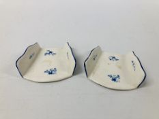 TWO DERBY ASPARAGUS SERVERS, OF FAN SHAPE, DECORATED IN DRY BLUE WITH SCATTERED SPRIGS, c.1780, 7.