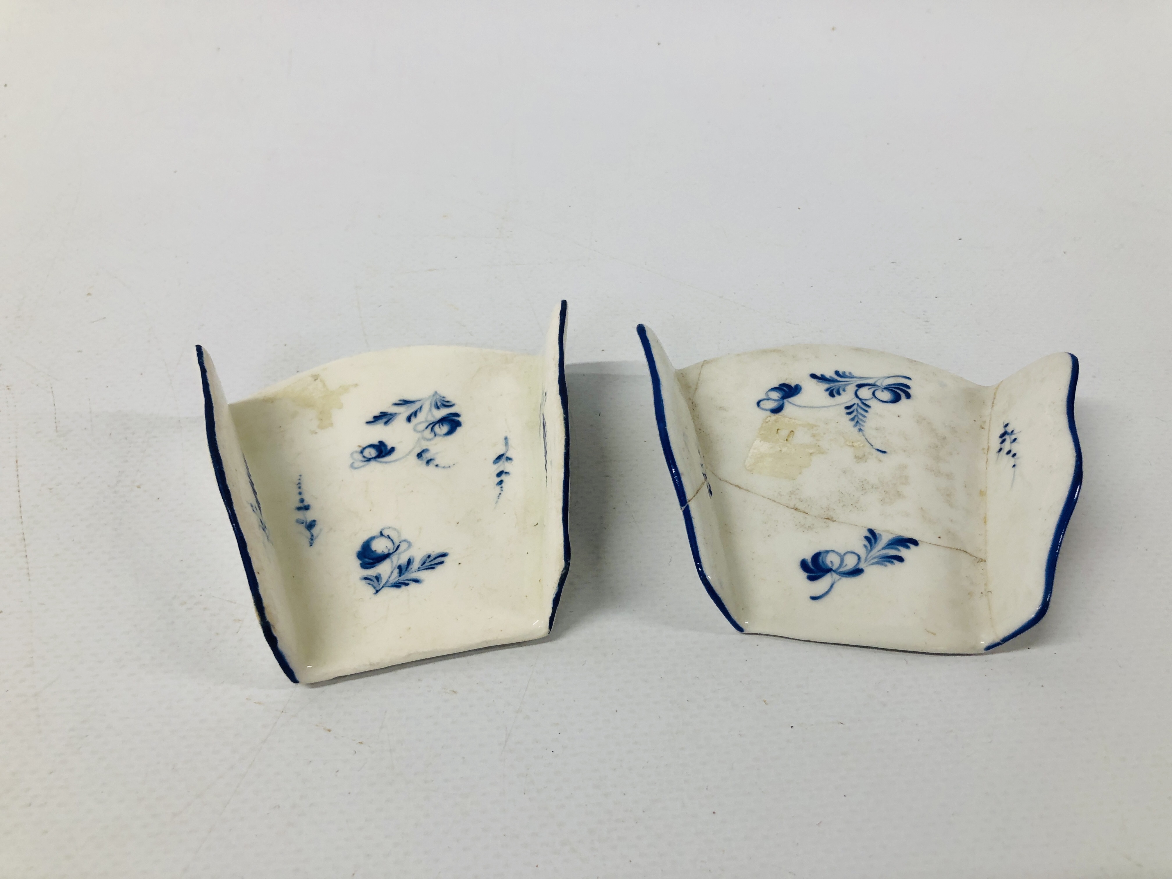 TWO DERBY ASPARAGUS SERVERS, OF FAN SHAPE, DECORATED IN DRY BLUE WITH SCATTERED SPRIGS,