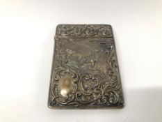 A DECORATIVE VINTAGE SILVER CARD CASE BIRMINGHAM ASSAY WITH RED DEER EMBOSSED DETAILING IN CASE