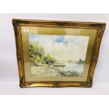 A FRAMED AND MOUNTED WATERCOLOUR "SHEPHERDESS FERRYING HER SHEEP ACROSS THE LAKE" BEARING SIGNATURE