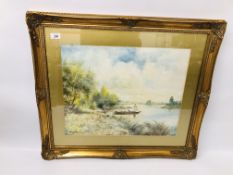 A FRAMED AND MOUNTED WATERCOLOUR "SHEPHERDESS FERRYING HER SHEEP ACROSS THE LAKE" BEARING SIGNATURE