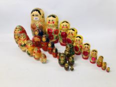 FOUR SETS OF GRADUATED RUSSIAN DOLLS, HANDPAINTED DESIGN.