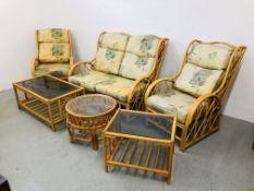 CANE CONSERVATORY SUITE COMPRISING TWO CHAIRS, TWO SEATER, TWO COFFEE TABLES AND LAMP TABLE.