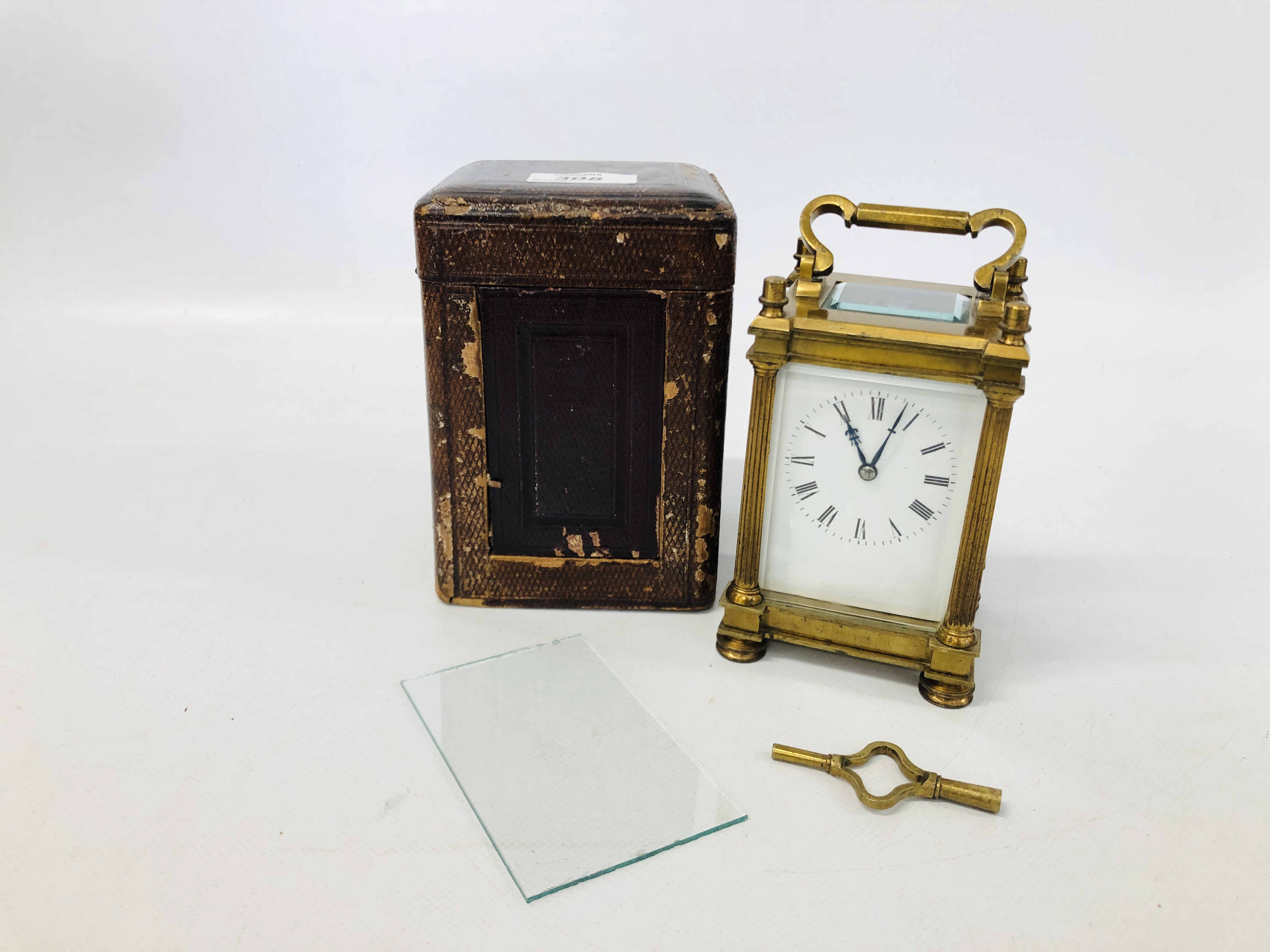 AN ANTIQUE BRASS CARRIAGE CLOCK WITH STRIKE C19TH IN ORIGINAL FITTED CASE WITH KEY HEIGHT 14CM.