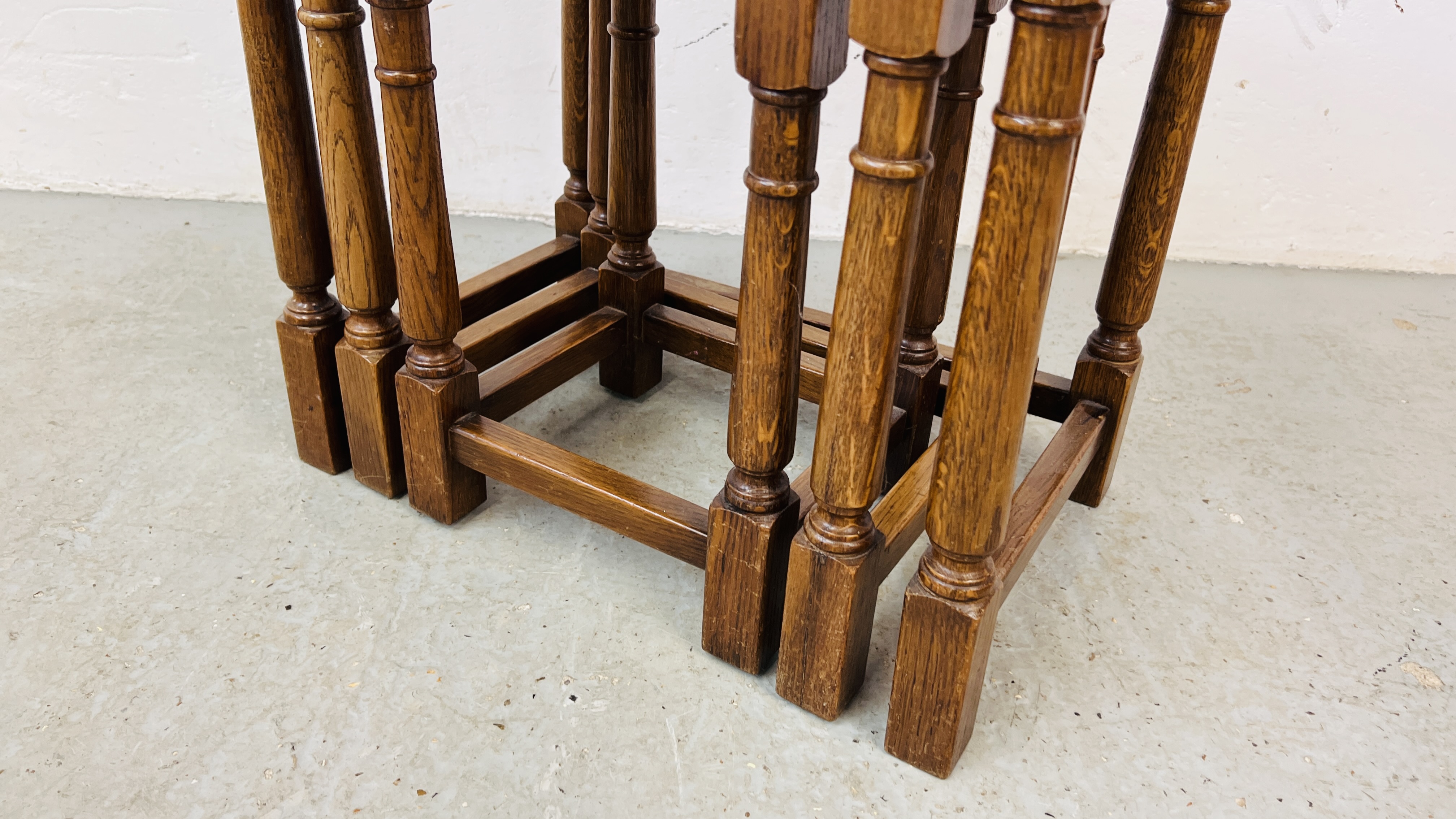 A SET OF GOOD QUALITY SOLID OAK NEST OF THREE TABLES. - Image 4 of 6