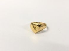 A GENTS 18CT SIGNET RING.