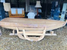 A PART BUILT WOODEN ROWING BOAT HULL FOR COMPLETION, LENGTH 3.5 METRES.