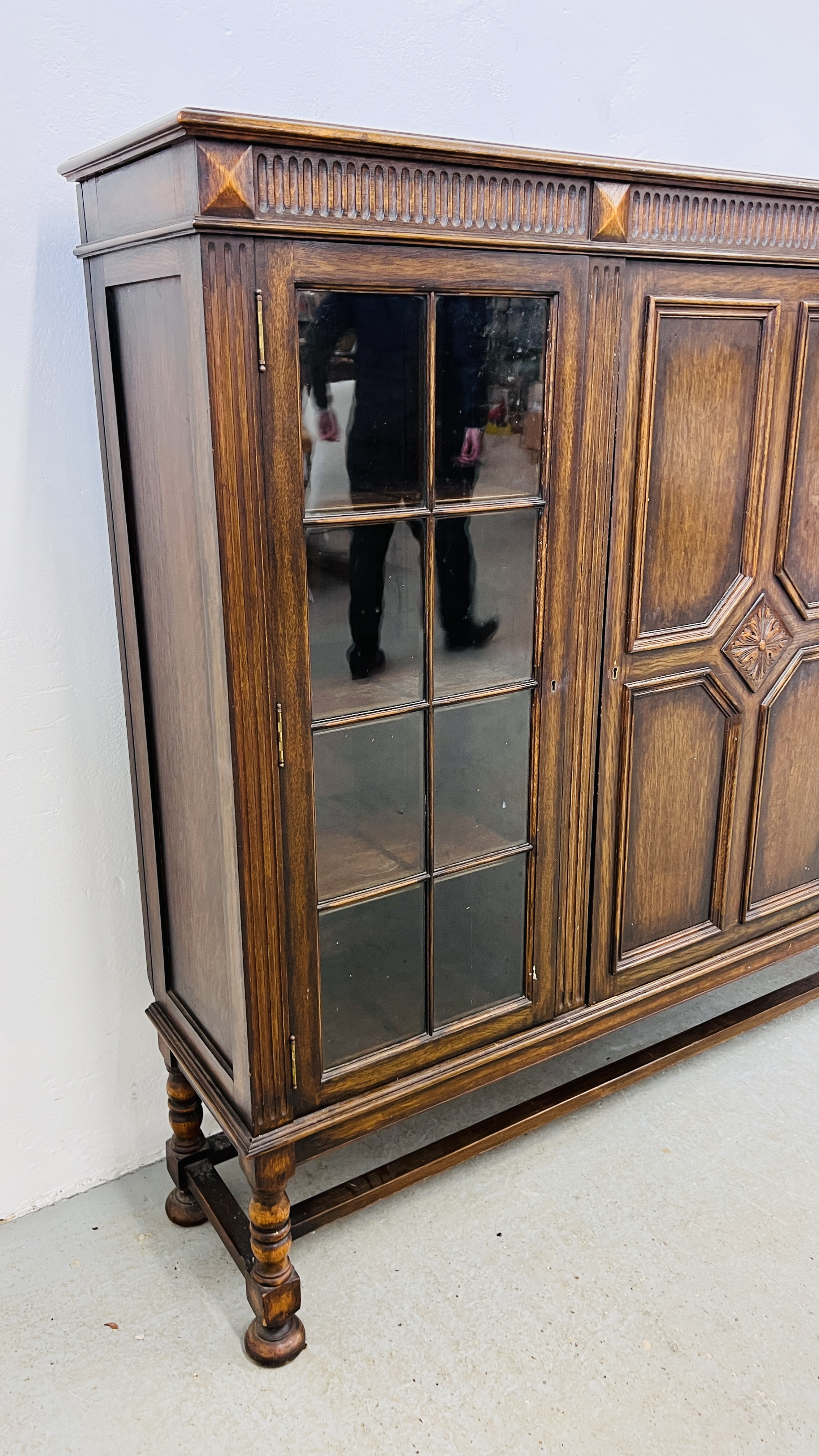 A 1930's OAK THREE DOOR CABINET STANDING ON LEG, - Image 7 of 13